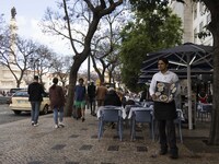 A waiter stands near a restaurant area located in front of Rossio square. Lisbon, May 23, 2022. The European Centre for Disease Prevention a...