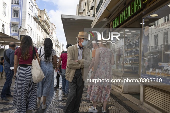 A person wearing a protective mask is seen walking in Augusta street, in downtown. Lisbon, May 23, 2022. The European Centre for Disease Pre...