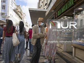 A person wearing a protective mask is seen walking in Augusta street, in downtown. Lisbon, May 23, 2022. The European Centre for Disease Pre...