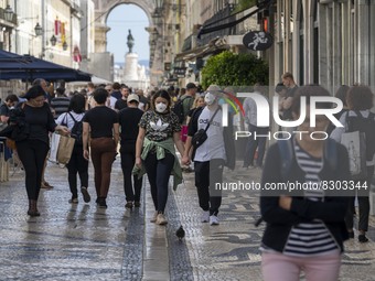 People wearing protective masks are seen walking in Augusta street, in the downtown area. Lisbon, May 23, 2022. The European Centre for Dise...