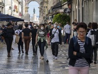 People wearing protective masks are seen walking in Augusta street, in the downtown area. Lisbon, May 23, 2022. The European Centre for Dise...