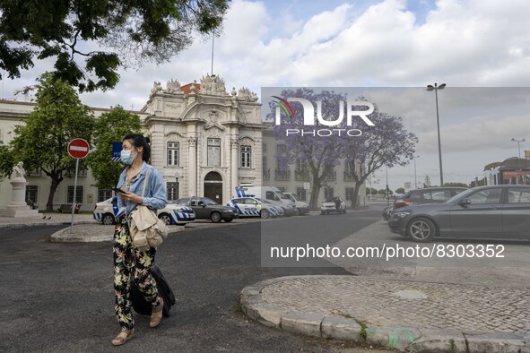 A woman is seen walking near the military museum, in the Santa Apolonia district. Lisbon, May 23, 2022. The European Centre for Disease Prev...