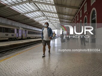 A person wearing a protective mask is seen walking inside the Santa Apolonia train station. Lisbon, May 23, 2022. The European Centre for Di...