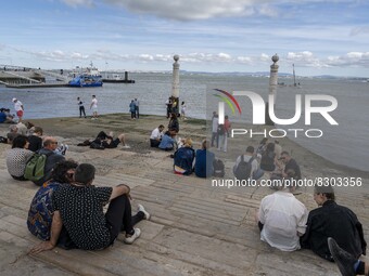 People are seen carrying out outdoor activities near the banks of the Tejo river, in Cais Das Colunas. Lisbon, May 23, 2022. The European Ce...