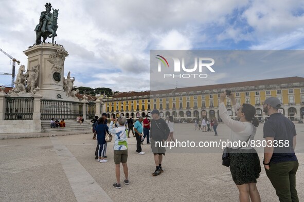 People are seen performing leisure activities near a monument in Praça de Comércio. Lisbon, May 23, 2022. The European Centre for Disease Pr...