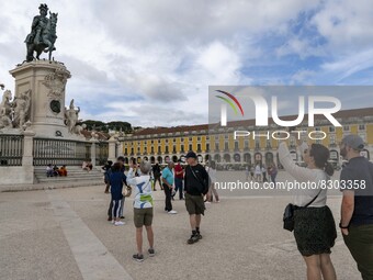 People are seen performing leisure activities near a monument in Praça de Comércio. Lisbon, May 23, 2022. The European Centre for Disease Pr...