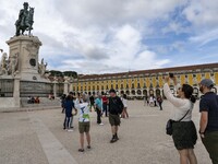 People are seen performing leisure activities near a monument in Praça de Comércio. Lisbon, May 23, 2022. The European Centre for Disease Pr...