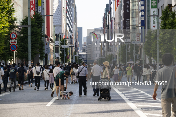 People walk and enjoy on a pedestrian mall at Ginza in Tokyo, Japan on 29 May. 