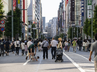 People walk and enjoy on a pedestrian mall at Ginza in Tokyo, Japan on 29 May. (