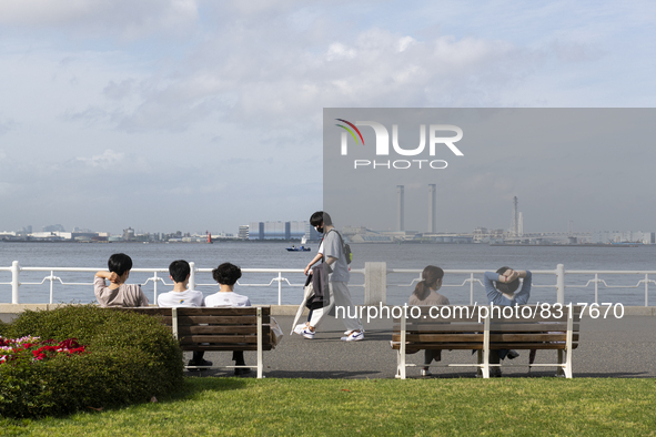 People enjoy the warmth of spring and sunshine at Yamashita park in Yokohama, Japan on 27 May. 