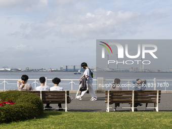 People enjoy the warmth of spring and sunshine at Yamashita park in Yokohama, Japan on 27 May. (