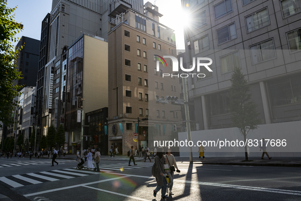 People walk and enjoy on a pedestrian mall at Ginza in Tokyo, Japan on 29 May. 