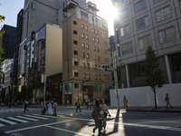 People walk and enjoy on a pedestrian mall at Ginza in Tokyo, Japan on 29 May. (