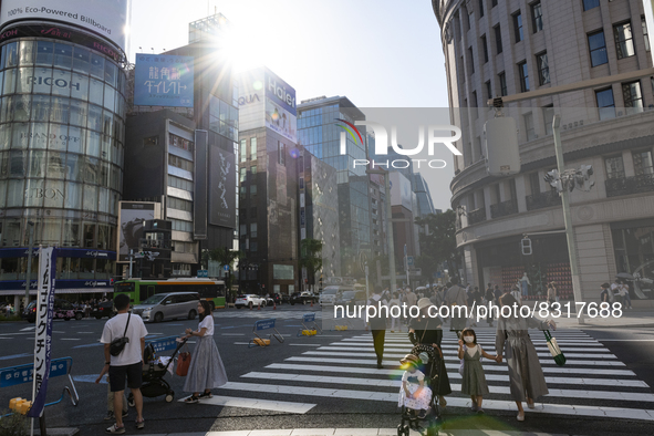 People walk and enjoy on a pedestrian mall at Ginza in Tokyo, Japan on 29 May. 