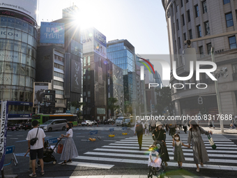 People walk and enjoy on a pedestrian mall at Ginza in Tokyo, Japan on 29 May. (