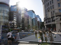 People walk and enjoy on a pedestrian mall at Ginza in Tokyo, Japan on 29 May. (