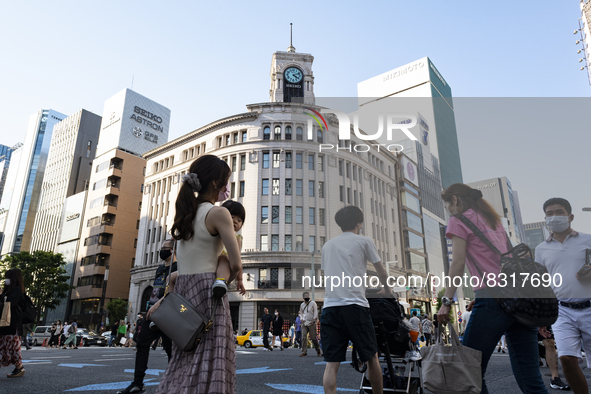 People walk and enjoy on a pedestrian mall at Ginza in Tokyo, Japan on 29 May. 