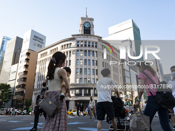 People walk and enjoy on a pedestrian mall at Ginza in Tokyo, Japan on 29 May. (