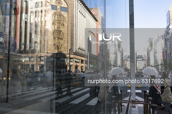 People walk and enjoy on a pedestrian mall at Ginza in Tokyo, Japan on 29 May. 