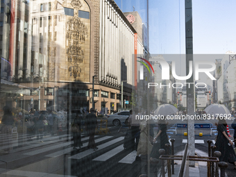 People walk and enjoy on a pedestrian mall at Ginza in Tokyo, Japan on 29 May. (