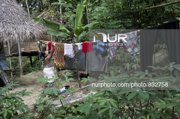 Mak Bakok(28) is hanging clothes Malaysia is one of the most fast developing country nevertheless , the modernism there is a group of people...