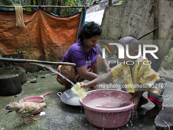 As water supply is limited , this is public place for wash dishes and have a shower. Malaysia is one of the most fast developing country nev...