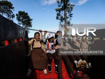 Students are huddling together in a truck to going school in Tugu Utara Village, Regency Bogor, West Java province, Indonesia on 2 June, 202...