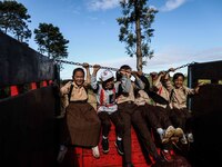 Students are huddling together in a truck to going school in Tugu Utara Village, Regency Bogor, West Java province, Indonesia on 2 June, 202...