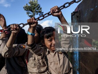 Students are huddling together in a truck to going school in Tugu Utara Village, Regency Bogor, West Java province, Indonesia on 2 June, 202...