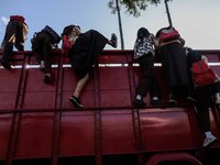 Students are huddling together in a truck to going school in Tugu Utara Village, Regency Bogor, West Java province, Indonesia on 2 June, 202...