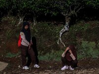 Students walking to school through the tea plantations in Tugu Utara Village, Regency Bogor, West Java province, Indonesia on 2 June, 2022....