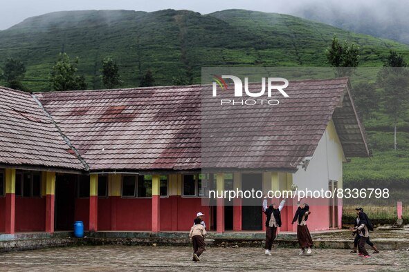 Students play during their half hour break before the end of the class day at a school in Tugu Utara Village, Regency Bogor, West Java provi...