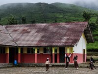 Students play during their half hour break before the end of the class day at a school in Tugu Utara Village, Regency Bogor, West Java provi...