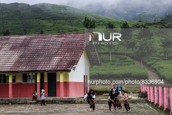 Students play during their half hour break before the end of the class day at a school in Tugu Utara Village, Regency Bogor, West Java provi...