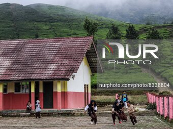 Students play during their half hour break before the end of the class day at a school in Tugu Utara Village, Regency Bogor, West Java provi...