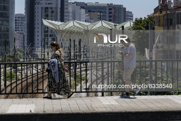 A group of people are seen performing outdoor activities in the surroundings of the Vasco da Gama walkway, close to the Tejo river. Lisbon,...