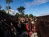 Students are huddling together in a truck to going school in Tugu Utara Village, Regency Bogor, West Java province, Indonesia on 2 June, 202...