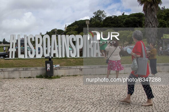 People are seen taking pictures in a tourist advertisement in the surroundings of the Marquez de Pombal monument. Lisbon, June 03, 2022. Por...