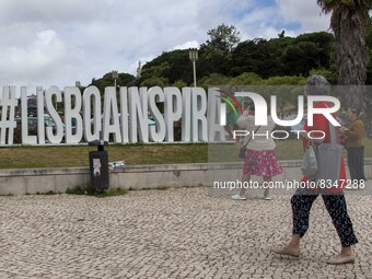 People are seen taking pictures in a tourist advertisement in the surroundings of the Marquez de Pombal monument. Lisbon, June 03, 2022. Por...