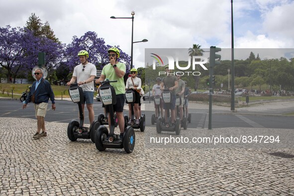 A group of people are seen taking a segway ride around the Marquez de Pombal monument. Lisbon, June 03, 2022. Portugal has already passed th...