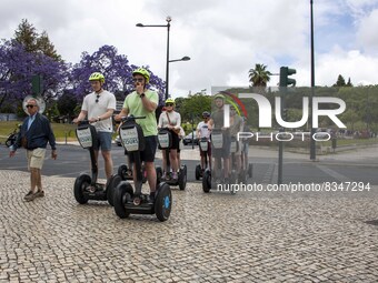 A group of people are seen taking a segway ride around the Marquez de Pombal monument. Lisbon, June 03, 2022. Portugal has already passed th...