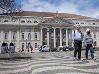 People wearing protective masks are seen walking near Rossio Square. Lisboa, June 03, 2022. Portugal has already passed the peak of this COV...