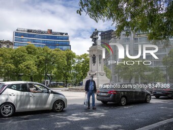 A person wearing a protective mask is seen walking in the vicinity of the Saldanha district. Lisbon, June 03, 2022. Portugal has already pas...