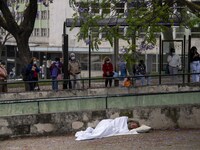 A person is seen sleeping near a bus station located near the gardens of Eduardo VII. Lisbon, June 03, 2022. Portugal has already passed the...