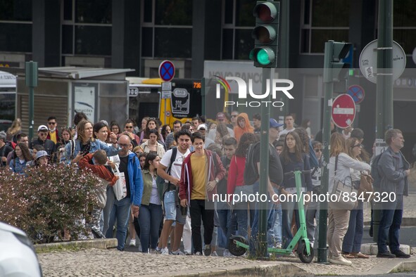 A group of people is seen walking along a nearby avenue that crosses the vicinity of Eduardo VII Gardens. Lisbon, June 03, 2022. Portugal ha...