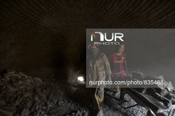 Two workers are take out the Charcoal from the dome / Kampung Keluat, Kelantan / Malaysia. *360 hours of waiting. 50 Cent's happy. Charcoal...