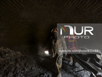 Two workers are take out the Charcoal from the dome / Kampung Keluat, Kelantan / Malaysia. *360 hours of waiting. 50 Cent's happy. Charcoal...