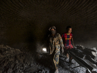 Two workers are take out the Charcoal from the dome / Kampung Keluat, Kelantan / Malaysia. *360 hours of waiting. 50 Cent's happy. Charcoal...