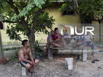 Charcoal workers are resting at their house. When they are not working they use to spend their time at the house / Kampung Keluat, Kelantan...