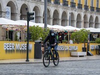 A delivery man wearing a protective mask is seen riding his bicycle on a street in Baixa district. Lisbon, June 03, 2022. According to data...